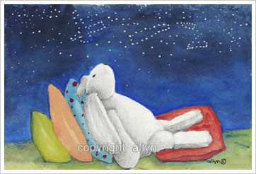 Resting on four pillows under the night sky
